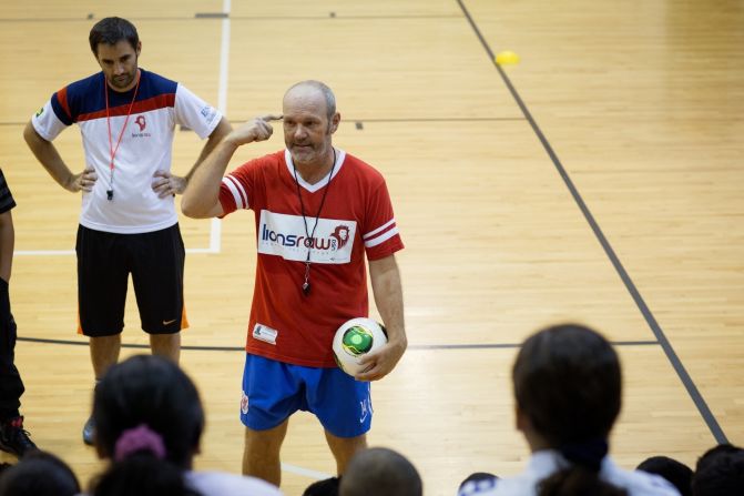Burns works at a recent soccer clinic in Dallas.