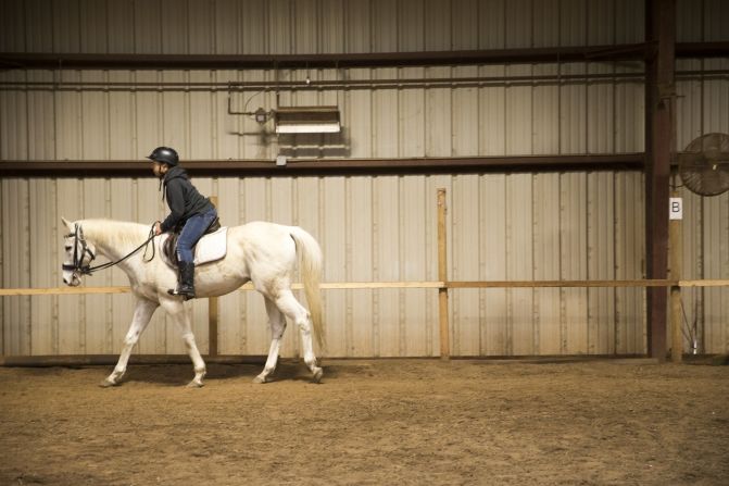 A child takes riding lessons at the center. "When you teach a child to ride a horse, they learn they are the center of their environment," Kelly said. "Once they make that connection, they can change what happens in school, at home and in the community."