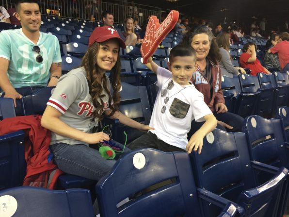 Ross helps prepare families for Phillies games by providing booklets illustrating each step of the game. She also escorts families to their first game, and each family is paired with a clinician should additional support be required.