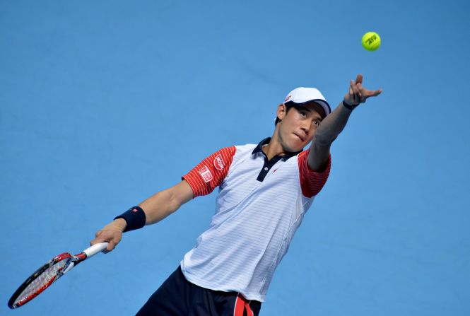Kei Nishikori unleashes a serve during his semifinal against Novak Djokovic at the ATP World Tour Finals.