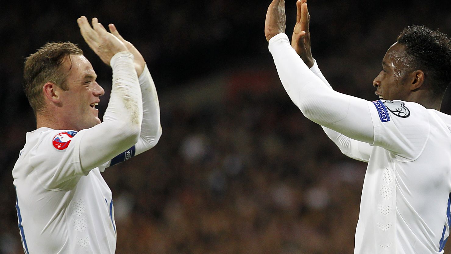 England scorers Wayne Rooney and Danny Welbeck (right) celebrate in the 3-1 win over Slovenia at Wembley.