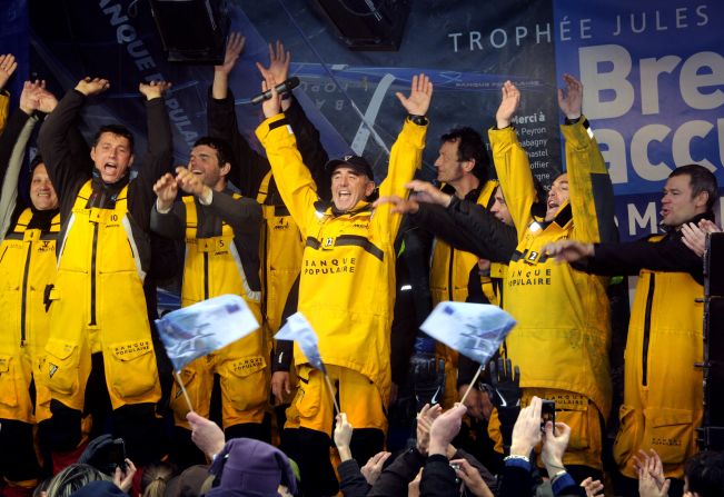 Peyron and his crew celebrate their success in claiming the Jules Verne Trophy in 2012 for the fastest circumnavigation of the world.