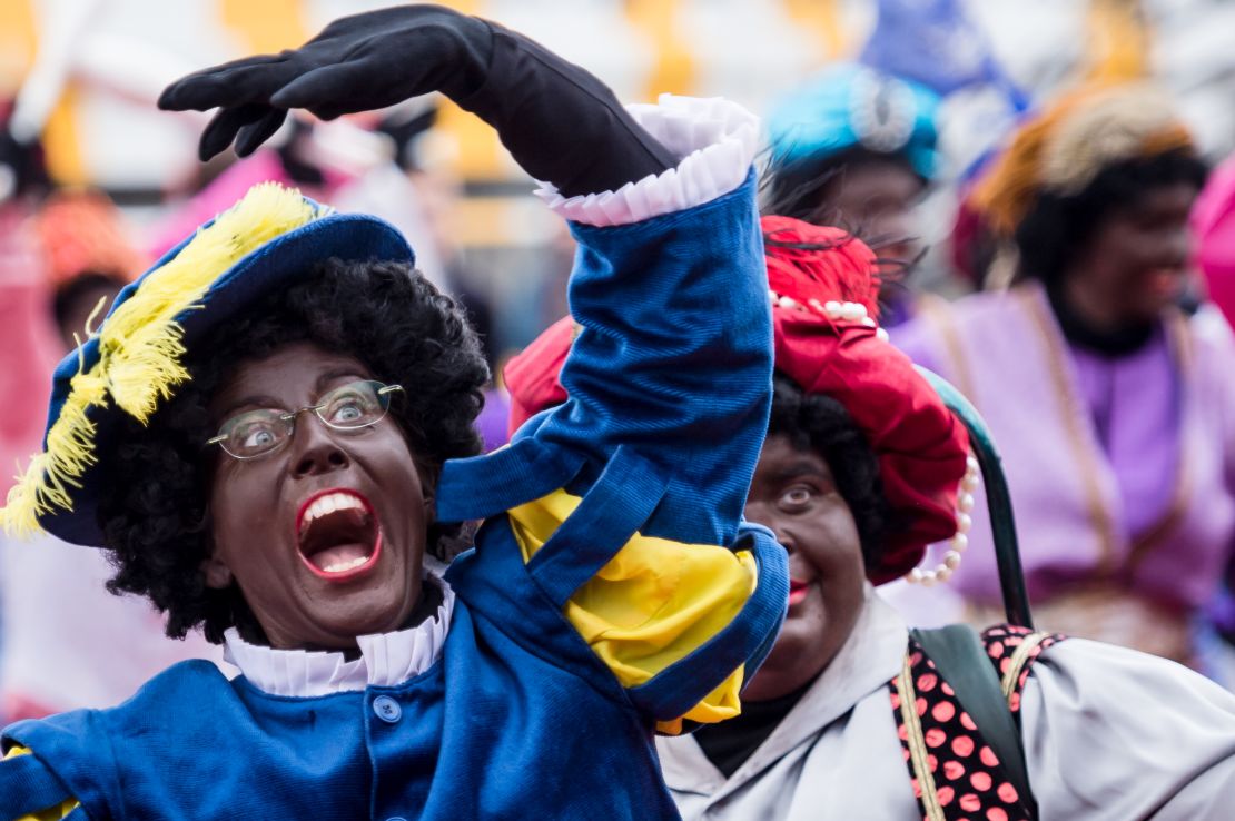 Actors dressed as Black Pete arrive on a boat in Antwerp, Belgium, on Saturday.