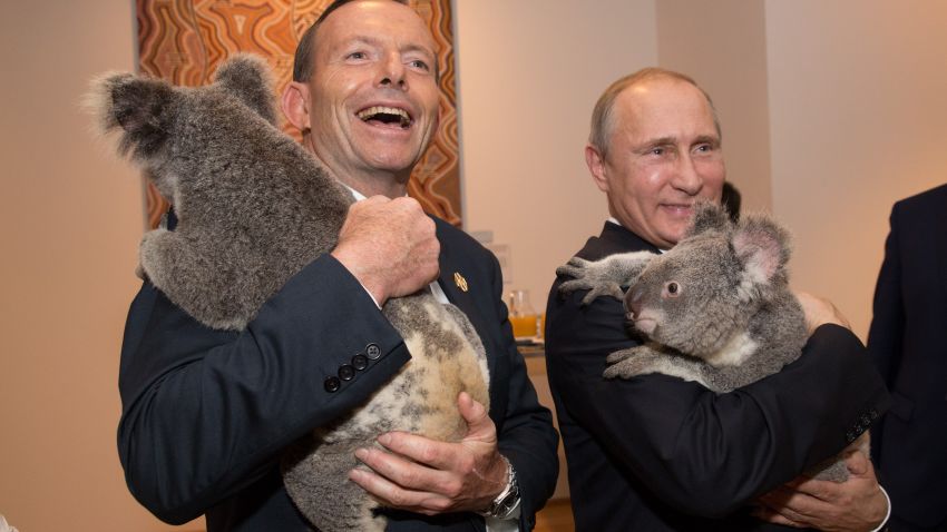 BRISBANE, AUSTRALIA - NOVEMBER 15: In this handout photo provided by the G20 Australia, Australia's Prime Minister Tony Abbott and Russia's President Vladimir Putin meet Jimbelung the koala before the start of the first G20 meeting on November 15, 2014 in Brisbane, Australia. World leaders have gathered in Brisbane for the annual G20 Summit and are expected to discuss economic growth, free trade and climate change as well as pressing issues including the situation in Ukraine and the Ebola crisis. (Photo by Andrew Taylor/G20 Australia via Getty Images)