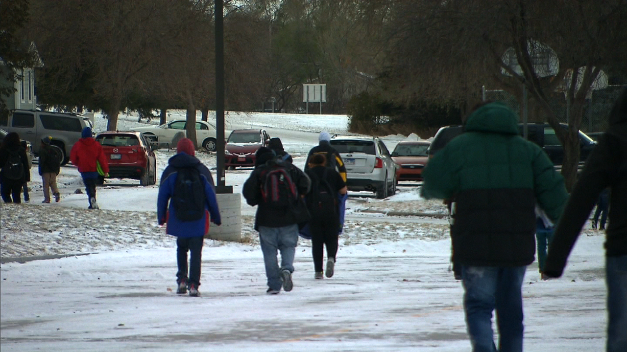 Children walk through the school after classes.