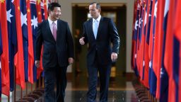 China's President Xi Jinping (L) and Australia's Prime Minister Tony Abbott walk together as they leave the House of Representatives at Parliament House in Canberra on November 17, 2014. Xi is visiting Canberra after attending the G20 Summit in Brisbane over the weekend. AFP PHOTO / POOL / Lukas CochLUKAS COCH/AFP/Getty Images