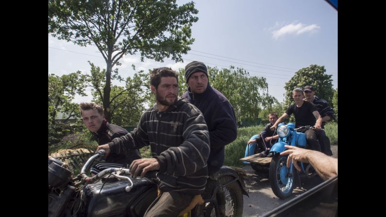Ukrainians in the village of Dimitrovka search for scraps to sell. Rocchelli was in the country to take photos of the conflict between Ukraine and pro-Russian rebels.