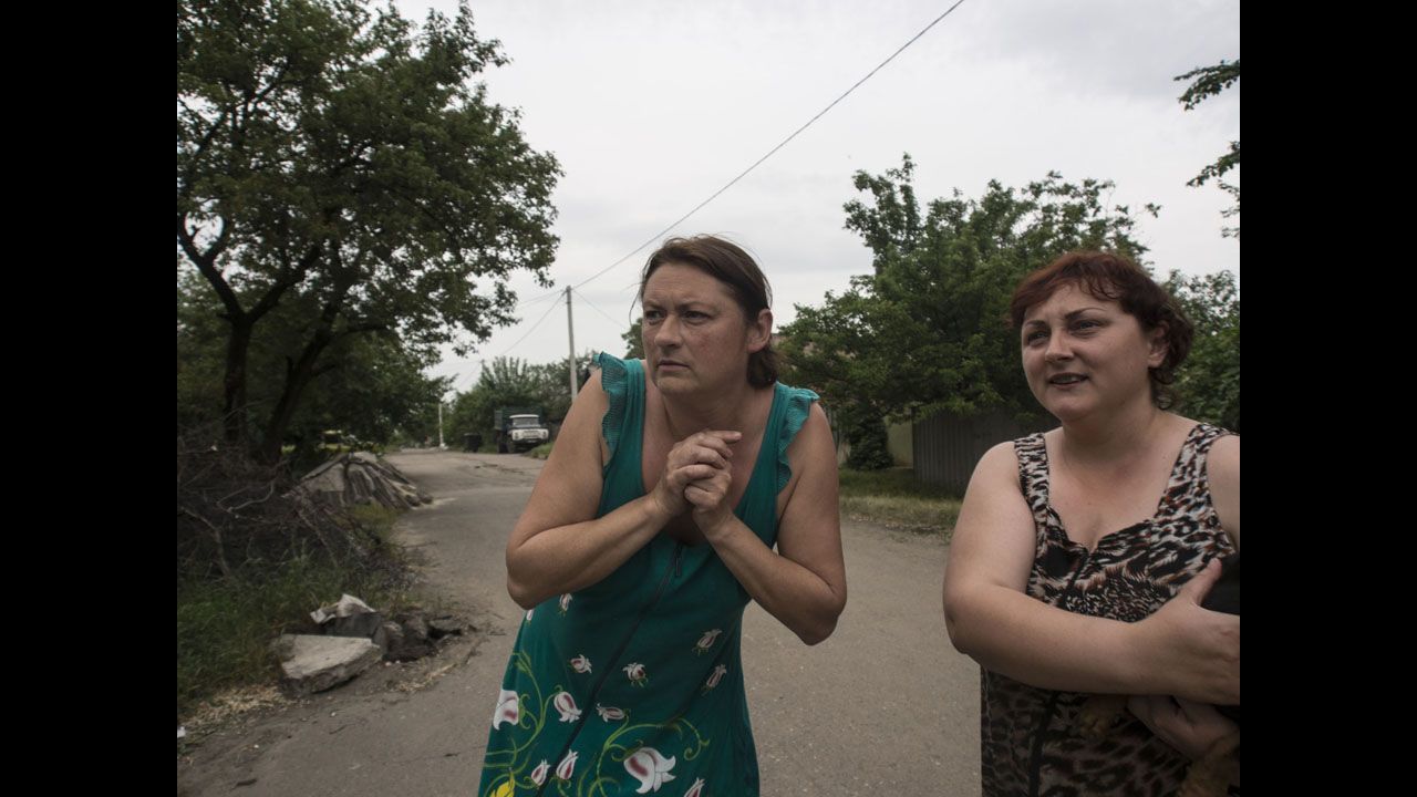 Civilians are seen in a Slovyansk street after bombing began. Rocchelli "was very sincere and dedicated to the stories he was doing," said colleague Luca Santese.