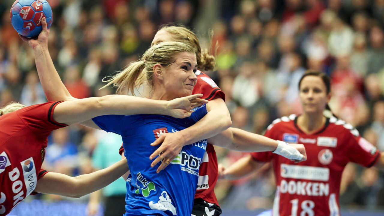 Angelica Wallen, a handball player with Randers HK, is challenged by two players from Team Esbjerg during a Danish league match Wednesday, November 12, in Esbjerg, Denmark.