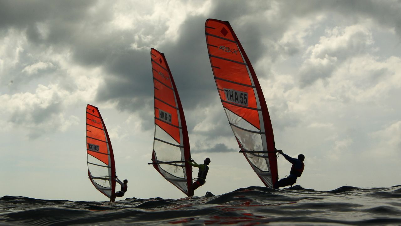 Windsurfers compete Sunday, November 16, during the Asian Beach Games in Phuket, Thailand.