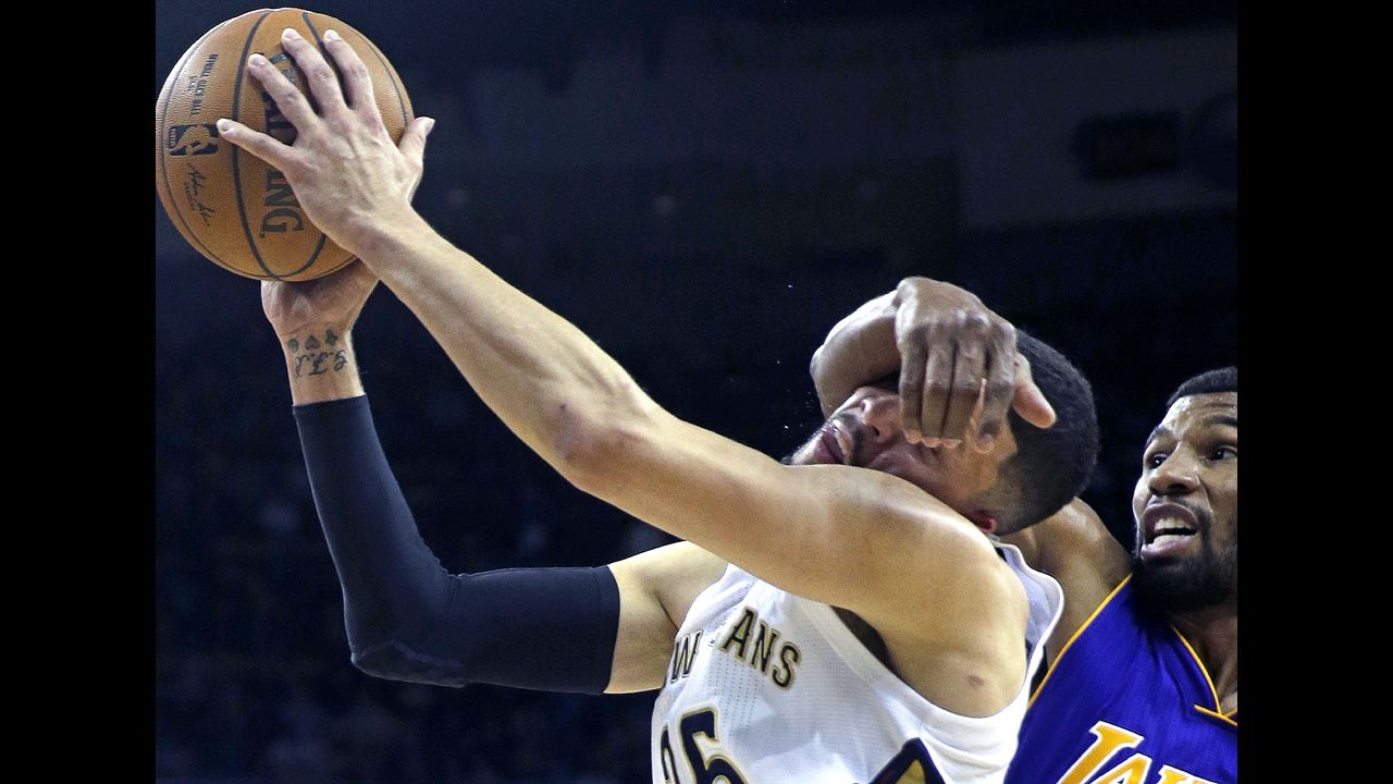 New Orleans guard Austin Rivers is fouled by Ronnie Price of the Los Angeles Lakers during the Pelicans' 109-102 victory on Wednesday, November 12. Price was ejected from the game for the flagrant foul.