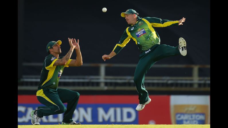 Australian cricket players Mitchell Johnson, left, and David Warner try to make a catch during the One Day International match against South Africa on Sunday, November 16. South Africa won by three wickets.