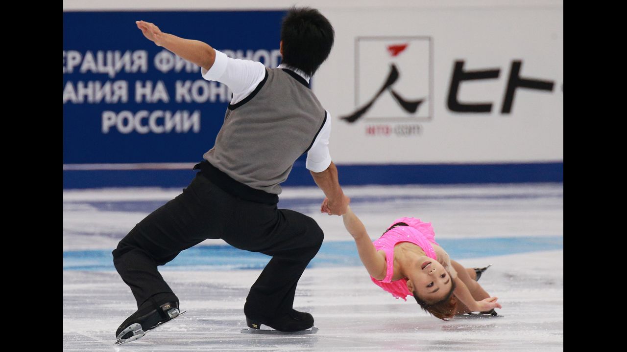 Japan's Ryuichi Kihara, left, and Narumi Takahashi skate together Friday, November 14, during the Rostelecom Cup in Moscow.