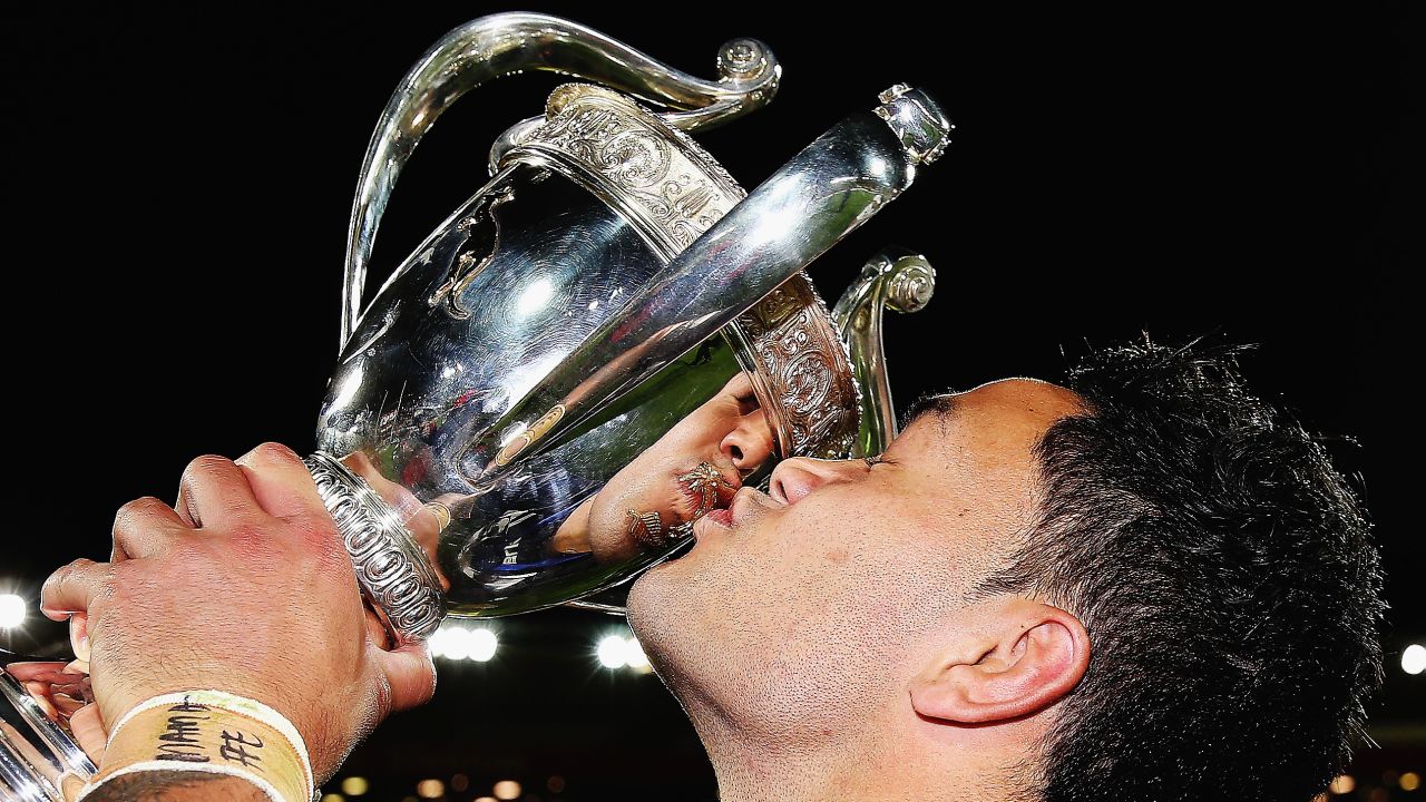Rugby player Issac Luke kisses the trophy after New Zealand defeated Australia to win the Four Nations tournament Saturday, November 15, in Wellington, New Zealand.