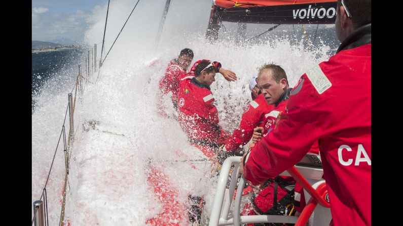 Members of the Dongfeng Race Team take a wave over the deck during a practice race for the Volvo Ocean Race on Friday, November 14. The Volvo Ocean Race is the world's premier ocean yacht race. The nine-month competition will visit 11 ports in 11 countries.