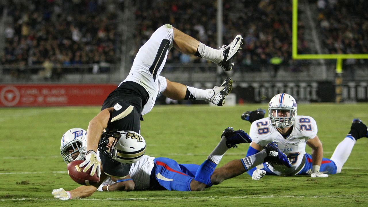 J.J. Worton of the UCF Knights leaps for a touchdown while playing Tulsa in Orlando, Florida, on Friday, November 14. The Knights rolled to a 31-7 victory.