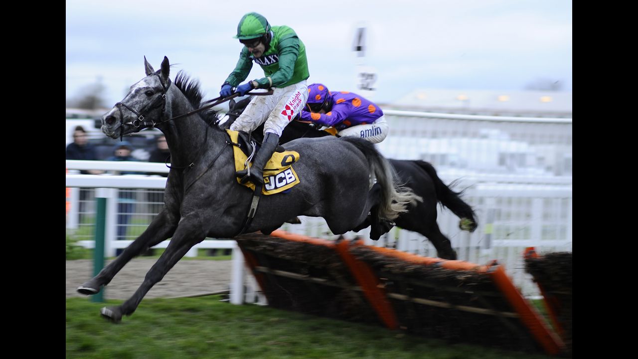 Tom Scudamore, riding Baraka De Thaix on the left, races in Cheltenham, England, on Saturday, November 15.