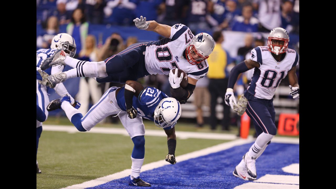 New England Patriots tight end Rob Gronkowski scores a touchdown over Indianapolis Colts cornerback Vontae Davis during the Patriots' 42-20 win on Sunday, November 15.