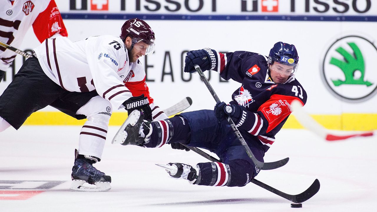 Jan Piskacek of Sparta Prague, left, and Broc Little of Linkoping battle for the puck during a Champions Hockey League game in Linkoping, Sweden, on Tuesday, November 11. The game ended 2-2 and Linkoping advanced to the tournament quarterfinals.