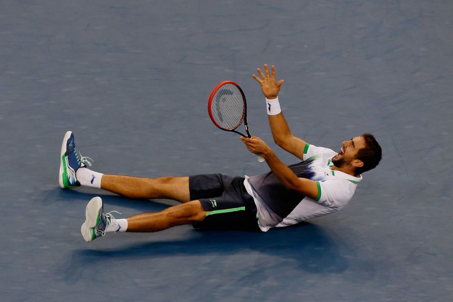 Cilic falls to the floor in joy after defeating Japan's Kei Nishikori to win the U.S. Open in September. 
