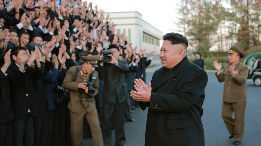 his undated photo released by North Korea's official Korean Central News Agency (KCNA) on November 15, 2014 shows North Korean leader Kim Jong-Un (front R) visiting the February 20 Factory of the Korean People's Army which produces foodstuff for servicemen, at an undisclosed location. Meanwhile, North Korea on November 15 warned of retaliatory strikes days after South Korea fired warning shots at a North Korean patrol near the border. REPUBLIC OF KOREA OUT AFP PHOTO / KCNA via KNS 
THIS PICTURE WAS MADE AVAILABLE BY A THIRD PARTY. AFP CAN NOT INDEPENDENTLY VERIFY THE AUTHENTICITY, LOCATION, DATE, AND CONTENT OF THIS IMAGE. THIS PHOTO IS DISTRIBUTED EXACTLY AS RECEIVED BY AFP.
