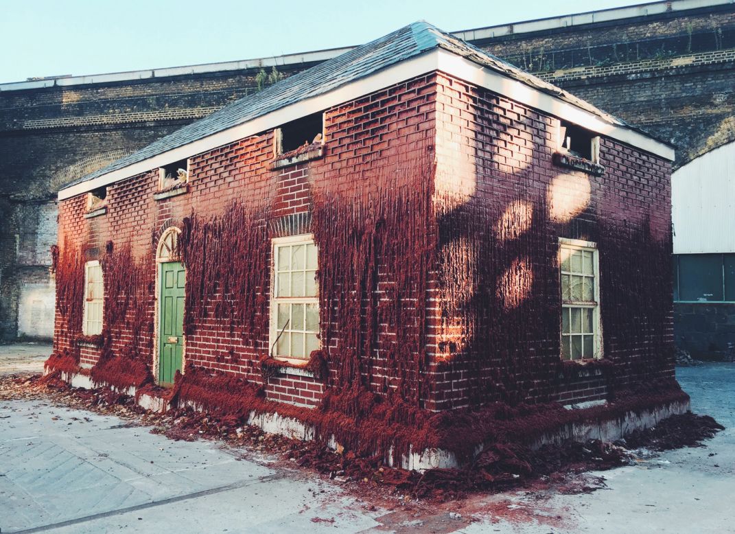 British artist Alex Chinneck creates playful architectural illusions in highly visible spaces. <em>A Pound of Flesh for 50p</em>, a full-scale house made of wax bricks installed in Southwark, is one of  his most recent projects.