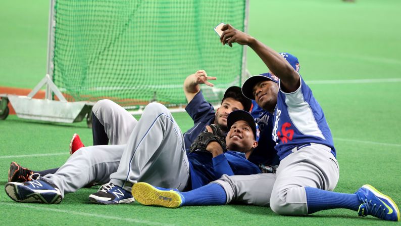 From left, Major League Baseball players Jose Altuve, Salvador Perez and Yasiel Puig take a selfie Tuesday, November 18, at the Sapporo Dome in Hokkaido, Japan. They were part of the MLB All-Stars team that played five exhibition games against Japan's national baseball team. Japan won three of the five games.