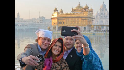 South Carolina Gov. Nikki Haley, second from left, poses in front of the Golden Temple, a Sikh holy shrine, during a visit to Amritsar, India, on Saturday, November 15. Haley's parents are Indian immigrants.
