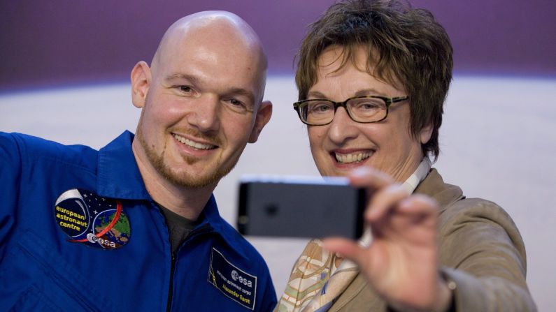 Alexander Gerst, an astronaut from the European Space Agency, poses for a selfie with German politician Brigitte Zypries on Thursday, November 13, in Cologne, Germany. Gerst recently returned to Earth following a mission on the International Space Station.