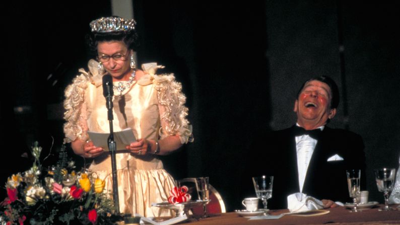 President Ronald Reagan laughing at the Queen's speech during a state dinner in San Francisco, California in 1983.