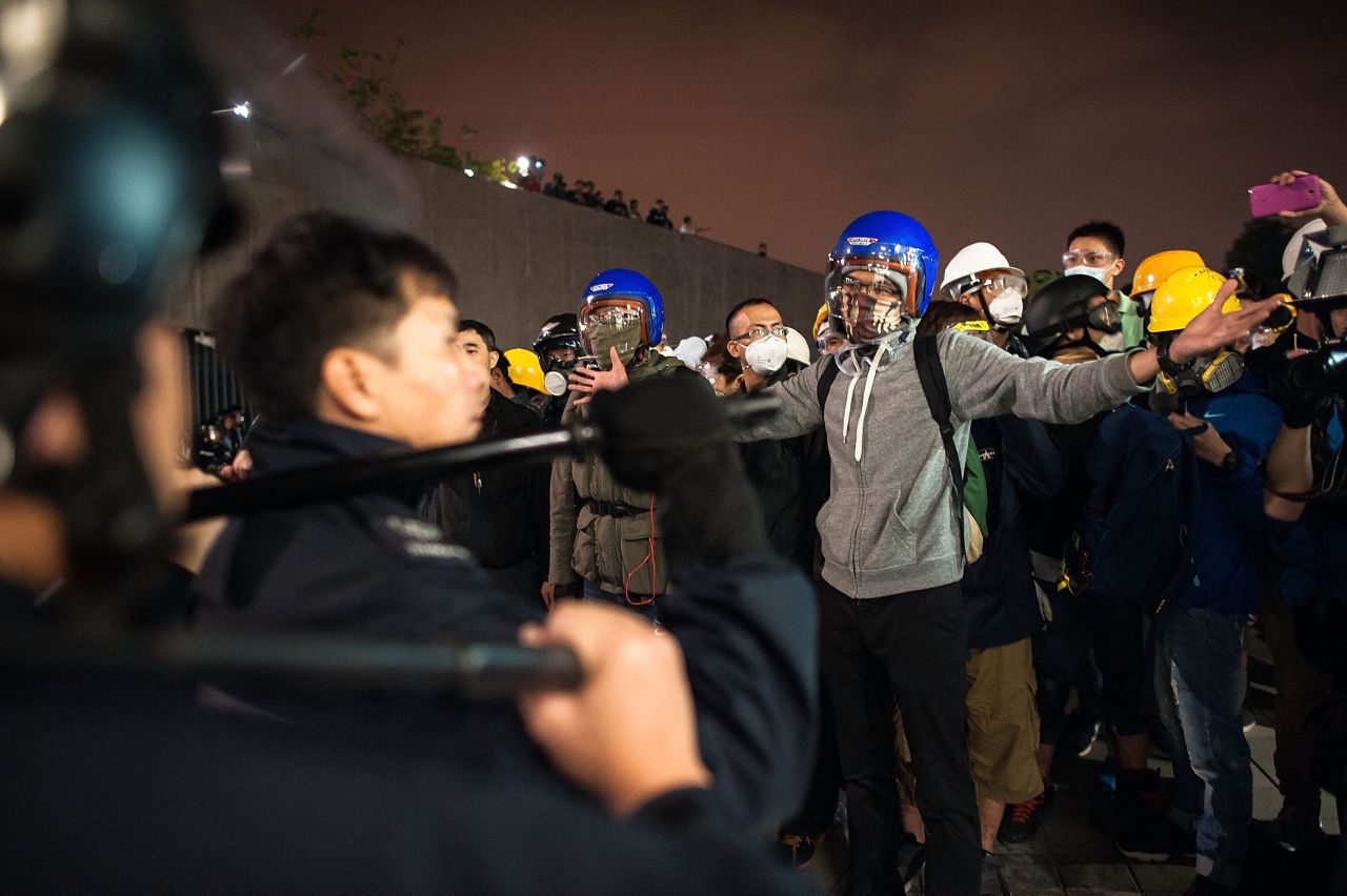Protesters stand off with police officers outside the Legislative Council building after clashes on November 19. 