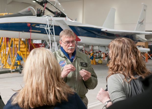 Tom Grindle, supervisor of aircraft missions operations, talks to attendees about an F-15 flight research support aircraft. 