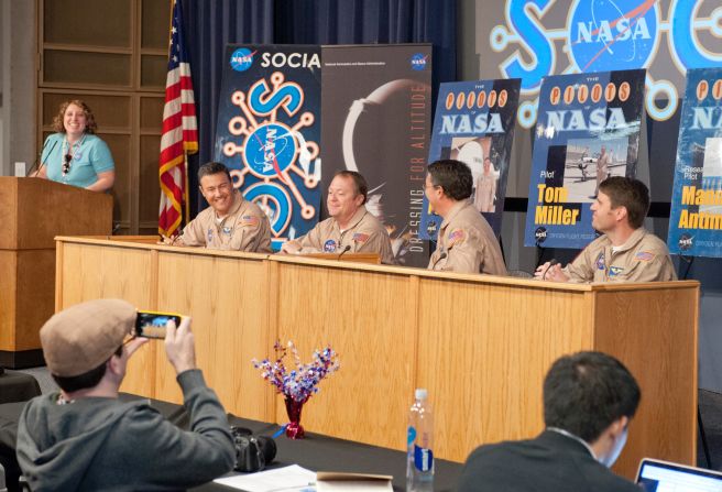 From left, NASA's Kate Squires leads a panel discussion with NASA pilots Hernan Posada, Tom Miller, Manny Antimisiaris and Scott Howe.