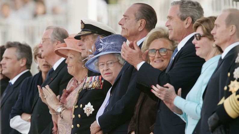 Queen Margrethe of Denmark, Prince Philip, Queen Elizabeth II, French President Jacques Chirac, Bernadette Chirac, U.S President George W Bush, First Lady Laura Bush and Russian President Vladimir Putin attend the commemoration ceremony on the 60th anniversary of D-Day, June 6, 2004 in Arromanches, France.