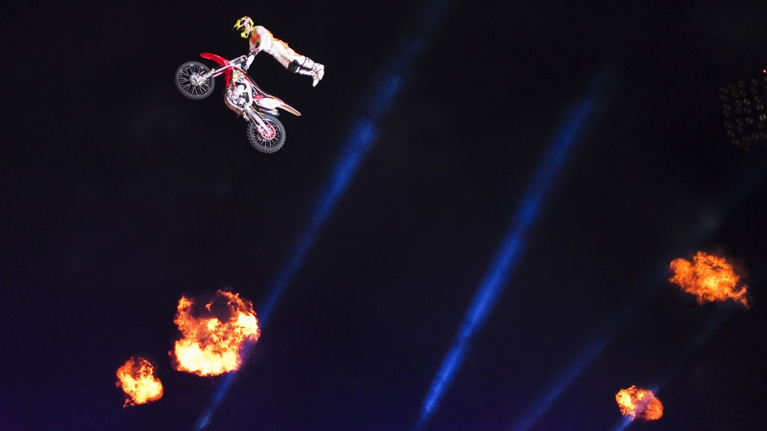 A motocross rider performs during a show in Ashkelon, Israel. Freestyle motocross involves high-flying stunts meant to impress judges.