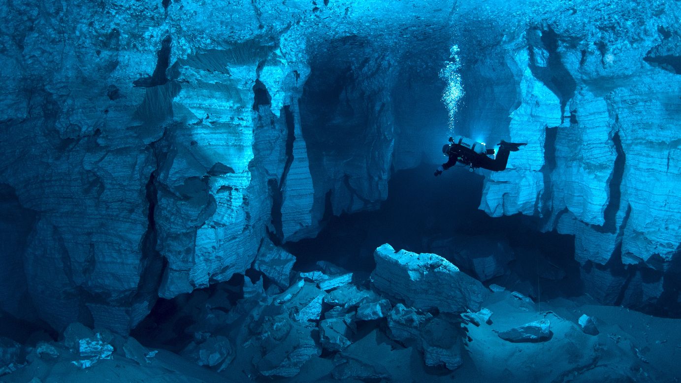 Cave divers explore the Orda Cave in Russia's western Urals region. Cave diving is one of the most dangerous kinds of diving or caving in the world and requires specialized equipment and training.