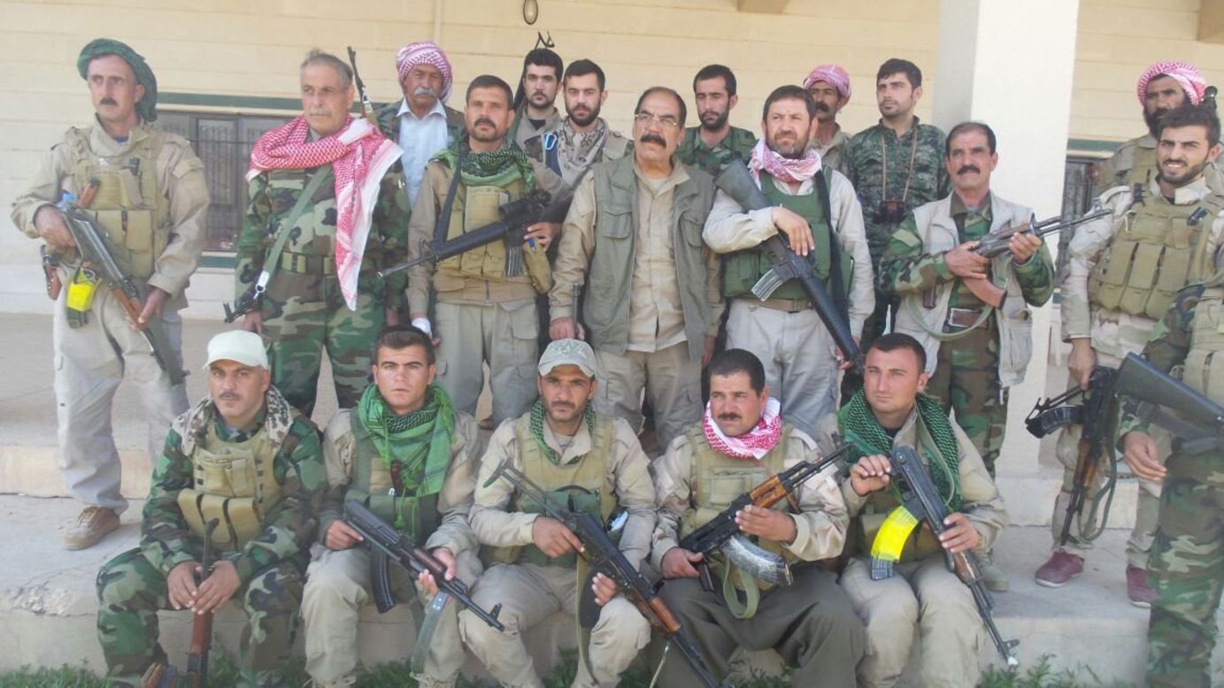 Shesho, center, is in charge of about 2,000 Yazidi fighters in the mountain range.