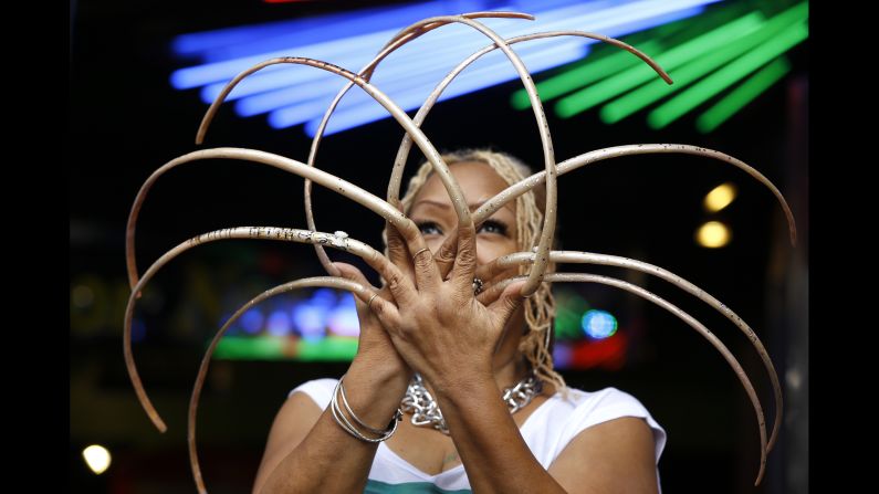 Ayanna Williams shows off her 23-inch nails at a book launch in London on Wednesday, November 19. Williams is featured in the book, a compendium of strange-but-true facts entitled "Ripley's Believe It or Not!: Reality Shock!"