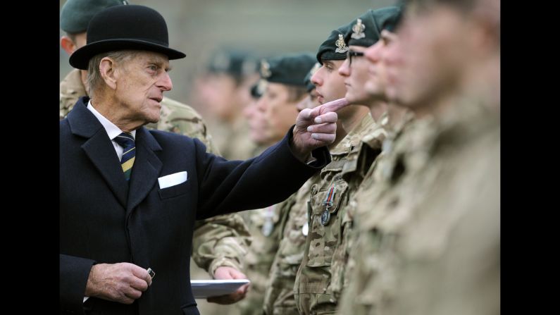 Britain's Prince Philip visits the armored regiment of the Queen's Royal Hussars in Paderborn, Germany, on Wednesday, November 19. He was awarding soldiers who just returned from Afghanistan.