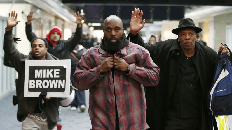 Michael Brown Sr., center, is greeted by supporters at the airport in St. Louis, Missouri, on Friday, November 14. Brown, the father of slain teenager Michael Brown Jr., had just returned from Geneva, Switzerland, where he and his son's mother <a href="http://www.cnn.com/2014/11/11/us/ferguson-brown-parents-u-n-/">spoke to the United Nations Committee Against Torture.</a> The committee also works against cruel or degrading treatment or punishment by government authorities. "We need the world to know what's going on in Ferguson and we need justice," the teen's mother, Lesley McSpadden, told CNN.