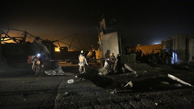 Afghan security forces inspect the site of a suicide attack in Kabul, Afghanistan, on Wednesday, November 19.