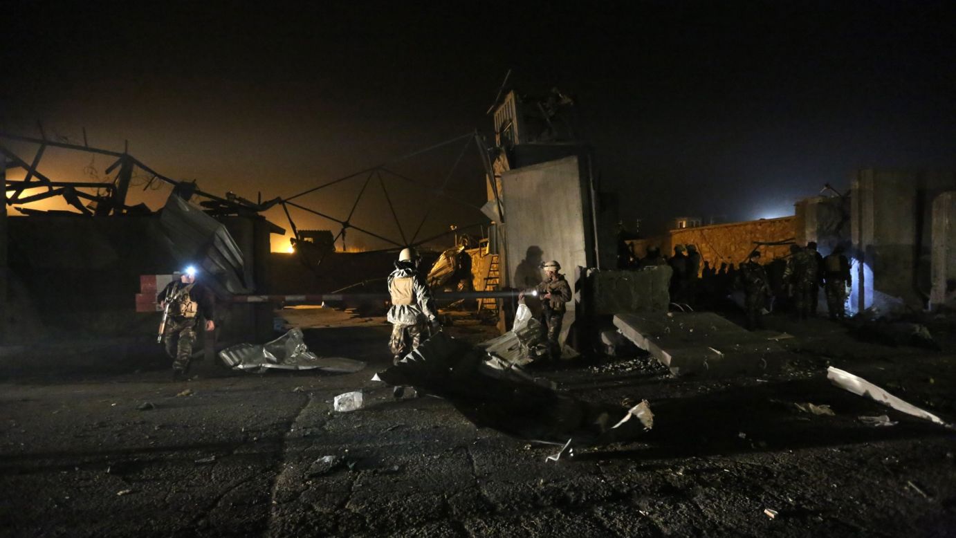 Afghan security forces inspect the site of a suicide attack in Kabul, Afghanistan, on Wednesday, November 19.