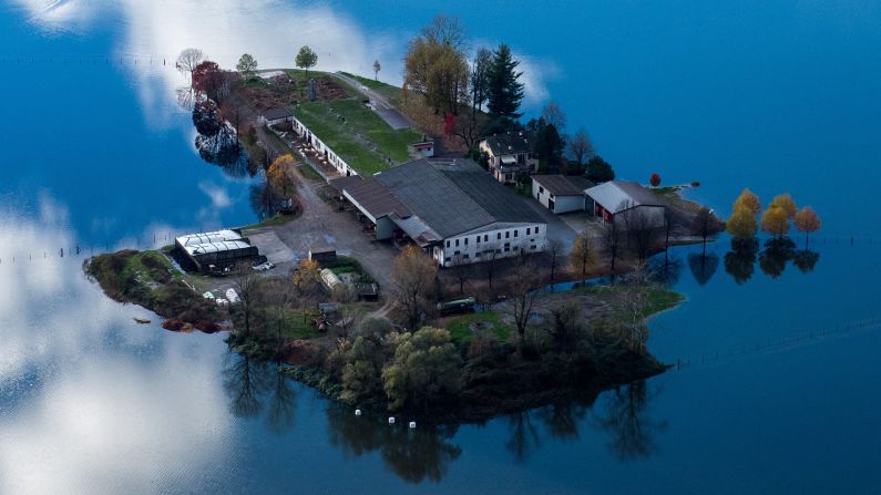 An aerial view shows a farm surrounded by floodwaters Sunday, November 16, near the Swiss village of Magadino. <a href="http://www.cnn.com/2014/11/14/world/gallery/week-in-photos-1114/index.html">See last week in 32 photos</a>