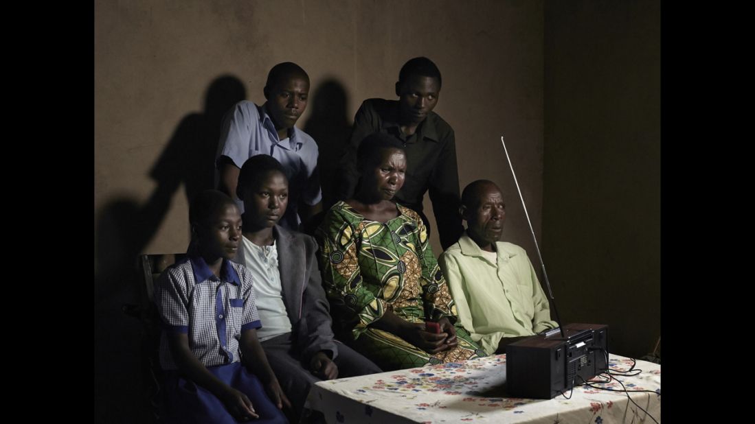 A family listens to the radio in Rwanda. A popular soap opera called "Musekeweya," or "New Dawn," is conveying a message of healing and reconciliation in the country, where more than 800,000 people were massacred two decades ago.