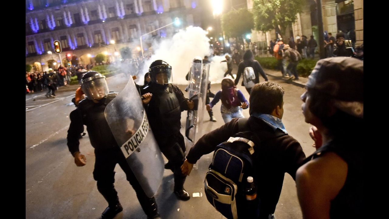 Demonstrators clash with riot police on November 20.