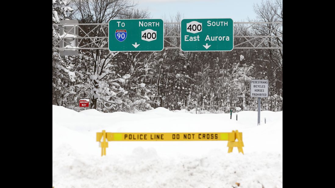 A police barrier prevents vehicles from entering Route 400 in West Seneca, New York, on November 20.