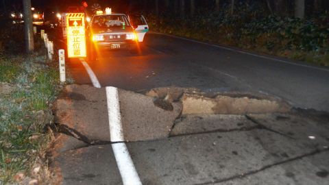 A road buckled after a strong earthquake hit central Japan. 