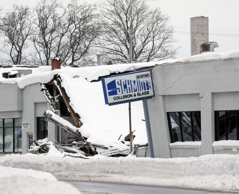 Heavy snow caused the roof of Schmidt's Collision and Glass to collapse in Hamburg, New York, on November 22.