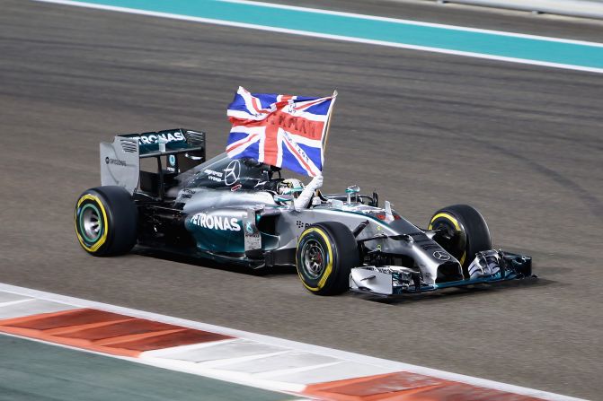 Get the flags out! Hamilton wins the 2014 Abu Dhabi Grand Prix and with it a second world title.