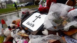 A man walks past a makeshift memorial on November 23, 2014 in Ferguson, Missouri, where a white Ferguson police officer who shot and killed 18-year-old black teenager Michael Brown. Brown's killing inflamed racial tensions in mostly black St Louis suburb of 21,000 with an overwhelmingly white police force and town government. Rising tensions in the predominantly African American community have seen US President Barack Obama call for calm, Missouri's governor declare a state of emergency and the FBI deploy an extra 100 personnel. AFP PHOTO/Jewel Samad (Photo credit should read JEWEL SAMAD/AFP/Getty Images)